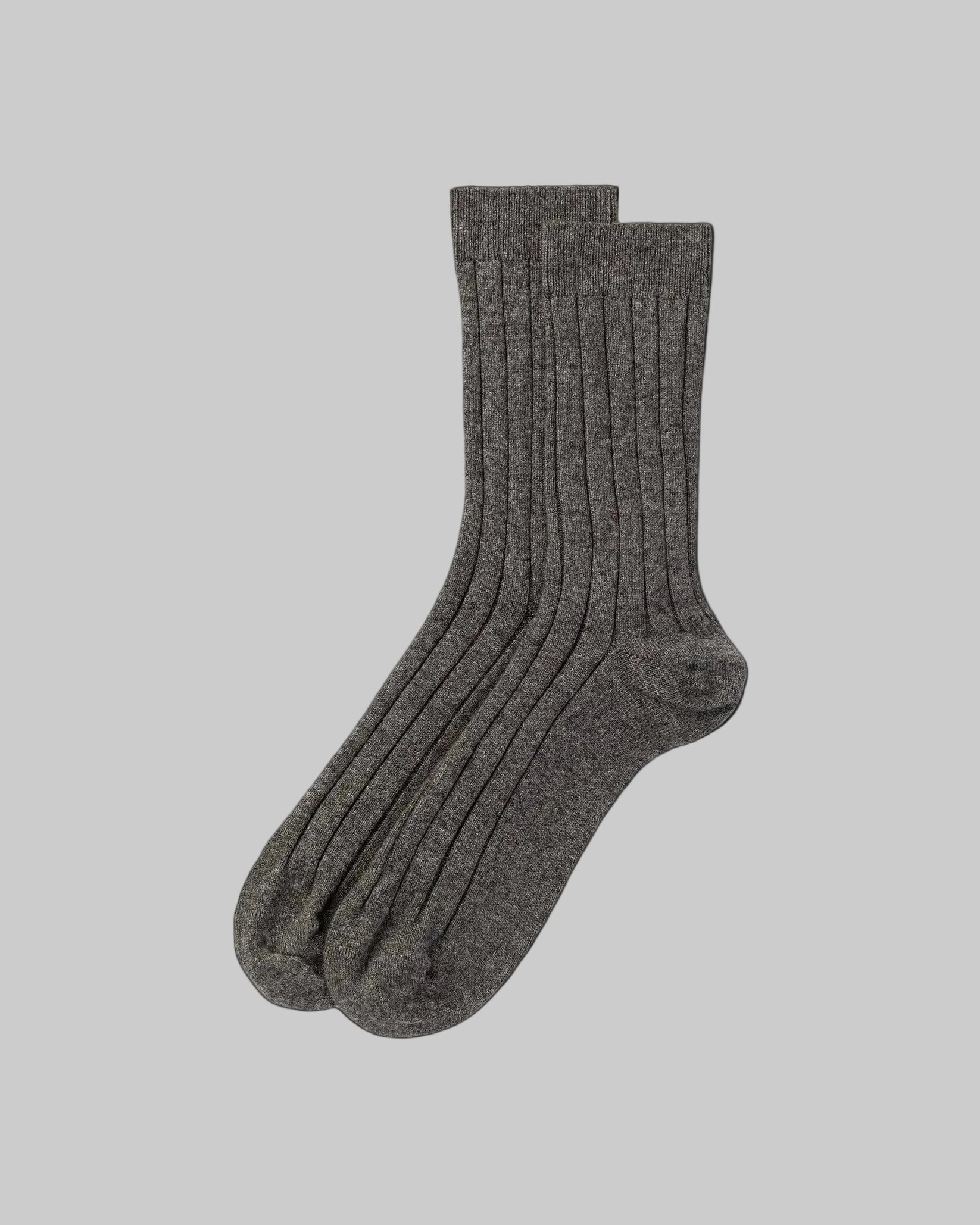 Pair of dark gray socks on a white background